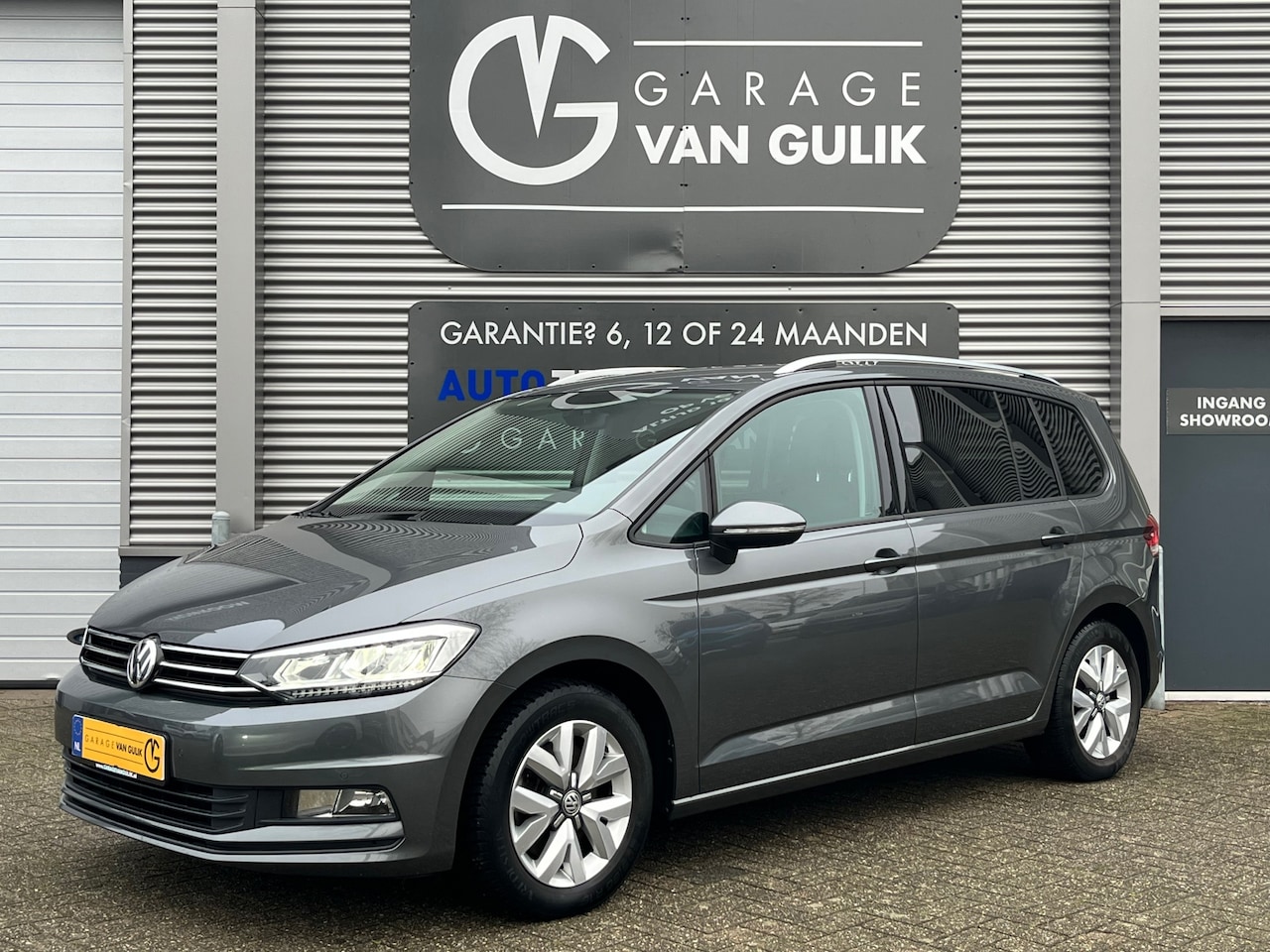 Volkswagen Touran - 1.4 TSI 110PK 7pers. Clima,Cruise,Trekhaak,Navi,Camera,PdcV+A,Isofix,ergoActive,Lmv,Armste - AutoWereld.nl