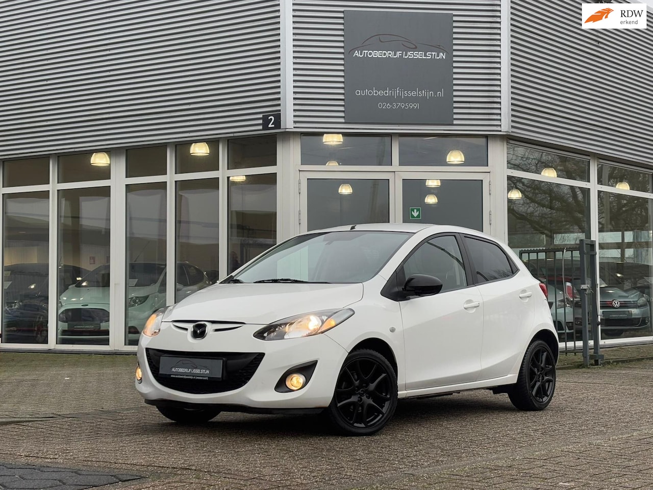 Mazda 2 - 1.3 5 Drs / Airco / Navi / Pdc / Stoelverw. - AutoWereld.nl