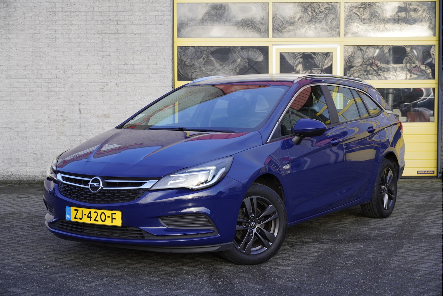 Opel Astra Sports Tourer - 1.0 Turbo 120 Jaar Edition BJ2019 Lmv 16" | Navi | Trekhaak | Airco | Cruise control | Get - AutoWereld.nl