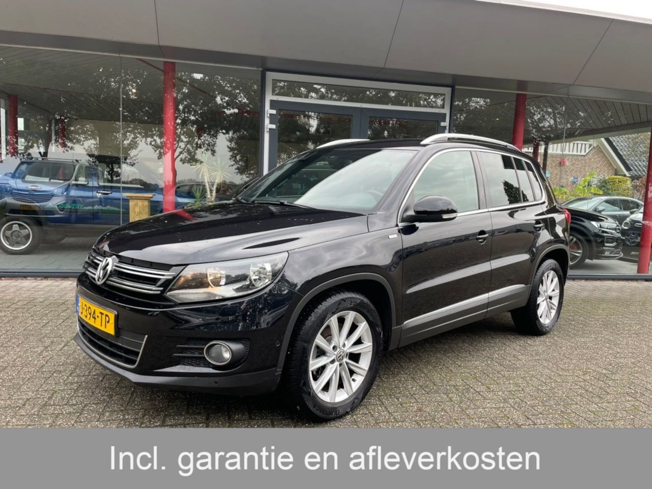 Volkswagen Tiguan - 1.4 TSI Sport&Style | Trekhaak | Cruise | - AutoWereld.nl