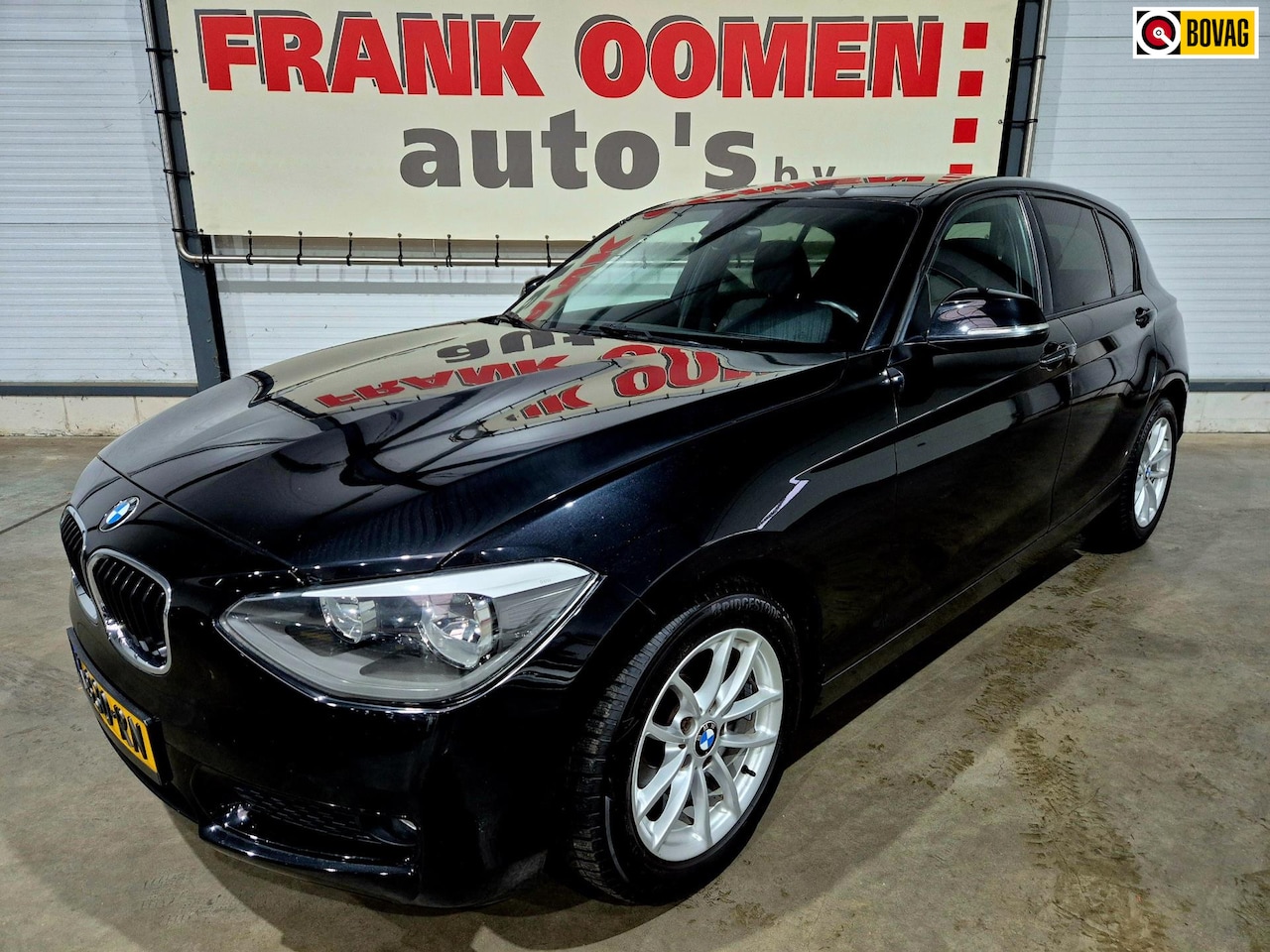 BMW 1-serie - 116i Urban 136PK + Leder/stof|PDC|Airco|Cruise|Stoelverw.|16"LMV - AutoWereld.nl