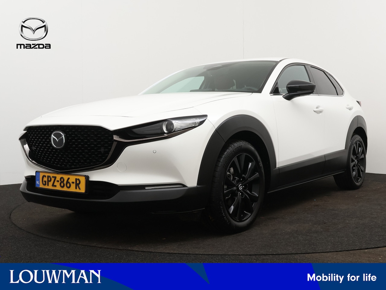 Mazda CX-30 - 2.0 e-SkyActiv-G M Hybrid Nagisa Limited | Leder/stof | Navigatie | Parkeersensoren | BOSE - AutoWereld.nl