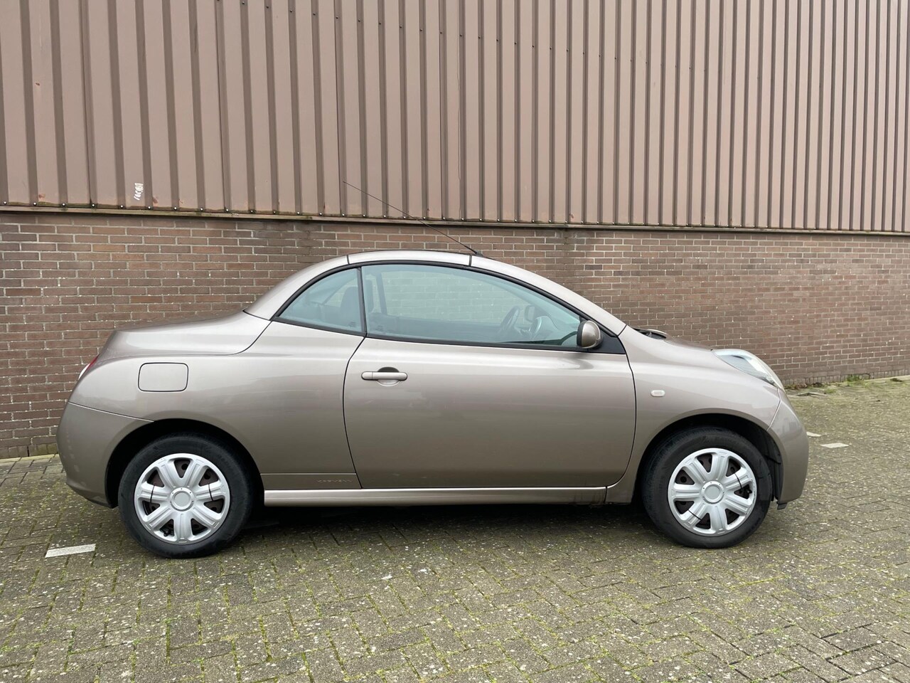 Nissan Micra - 1.4 Tekna Cabrio Clima APK NAP Glasdak - AutoWereld.nl