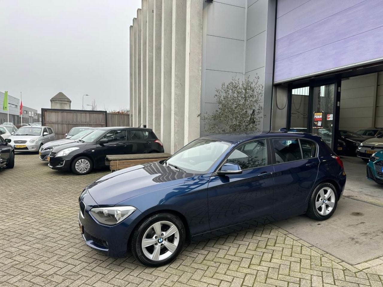 BMW 1-serie - 118i Sport Line Automaat! NETTE AUTO! INRUIL MOGELIJK! - AutoWereld.nl