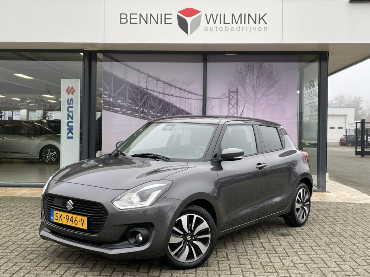 Suzuki Swift - 1.0 Boosterjet Stijl Smart Hybrid - AutoWereld.nl