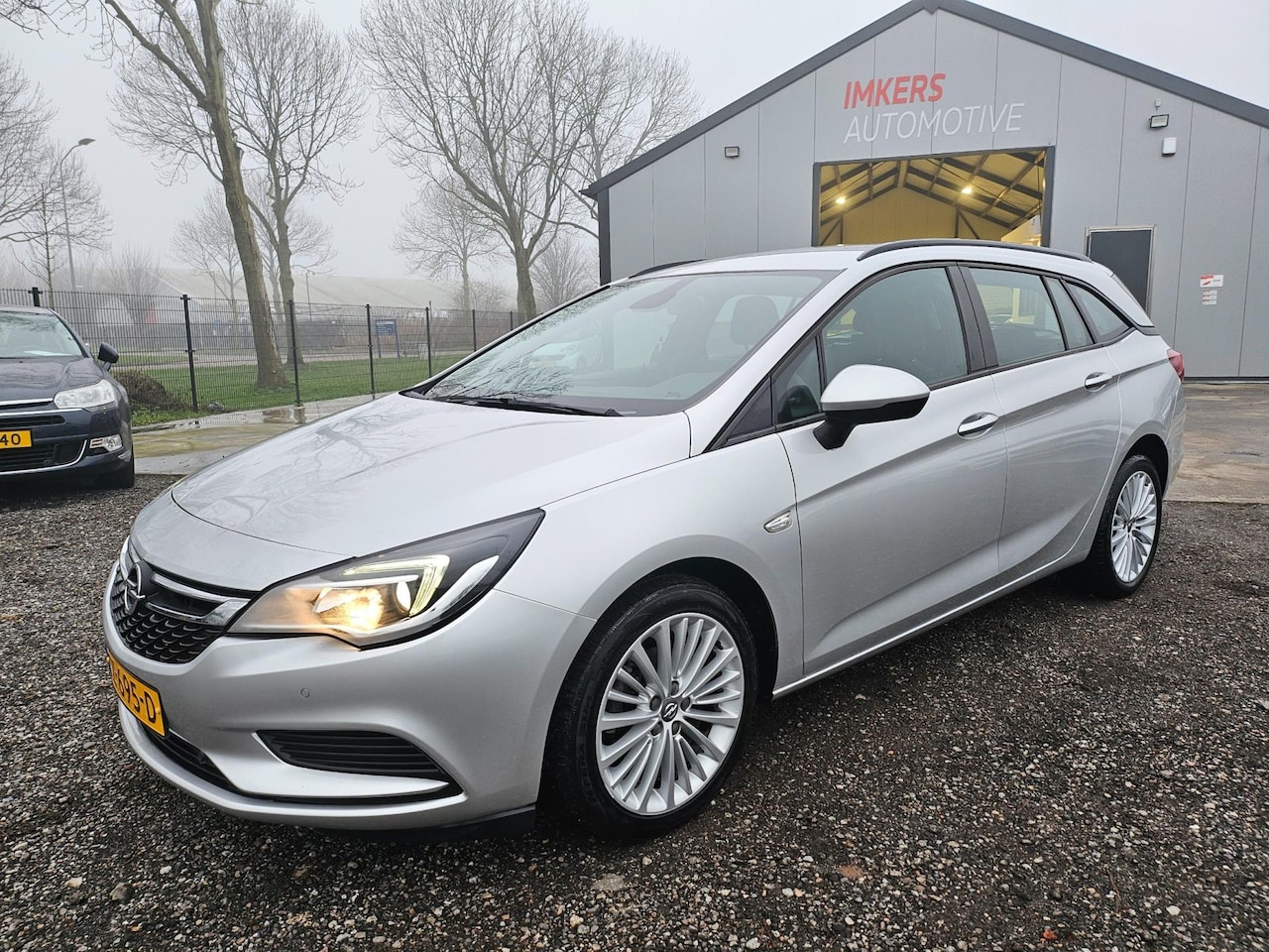 Opel Astra Sports Tourer - 1.4 Business Executive AUT - AutoWereld.nl