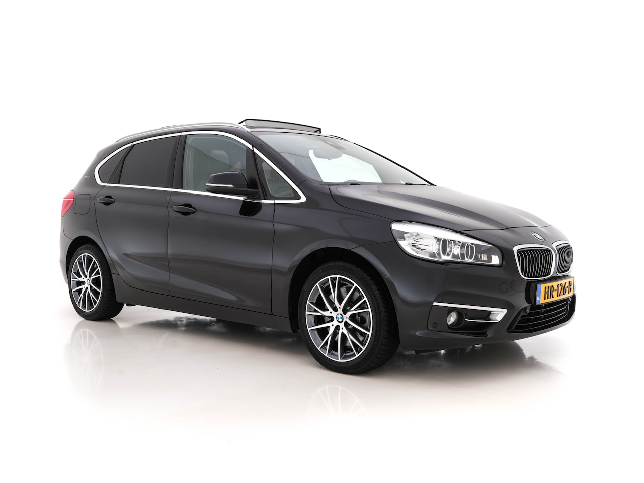 BMW 2-serie Active Tourer - 225xe Centennial High Executive Aut. *PANO | HEAD-UP | ADAPTIVE-CRUISE | DAKOTA-FULL-LEATH - AutoWereld.nl