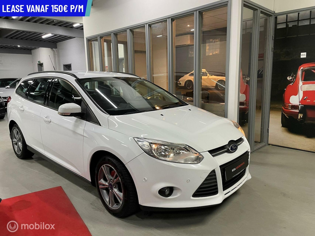 Ford Focus Wagon - 1.0 TURBO TITANIUM NAVI CLIMA PDC - AutoWereld.nl