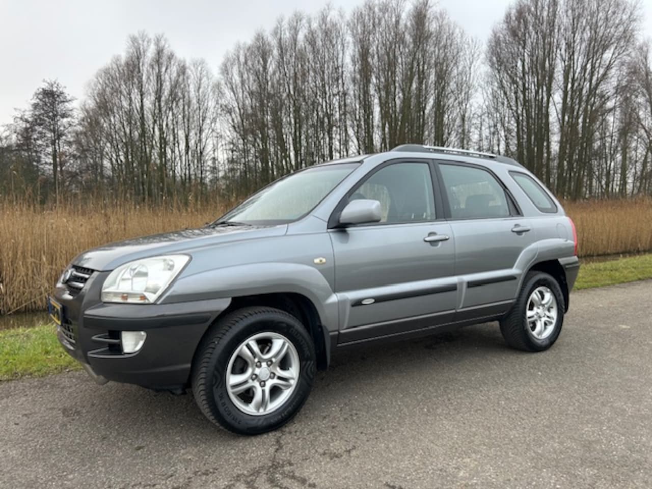 Kia Sportage - 2.0 2WD EXECUTIVE | Apple carplay / Android auto Trekhaak | Airco | All season banden | Cr - AutoWereld.nl