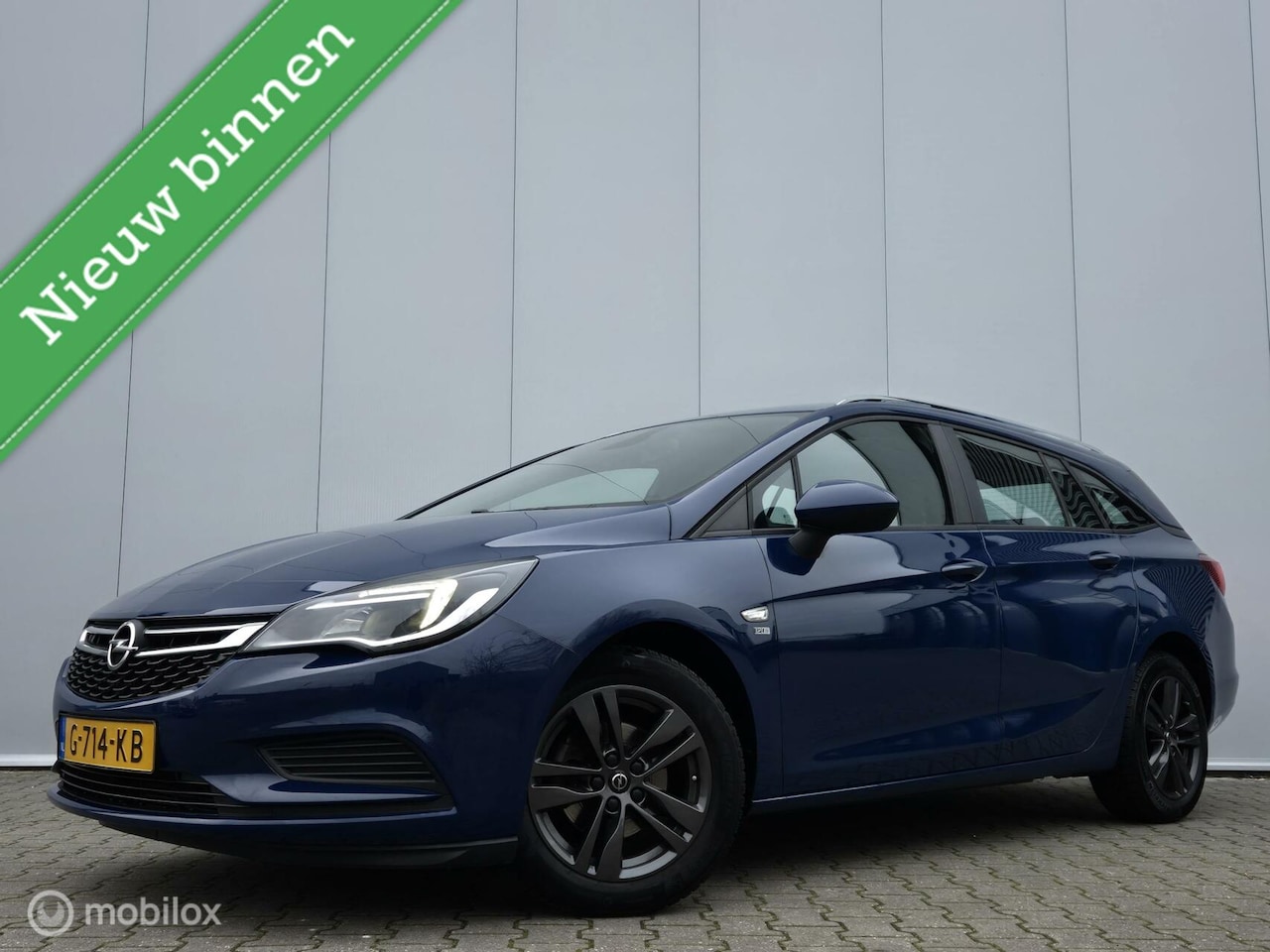 Opel Astra Sports Tourer - 1.0 TURBO 120 JAAR/CARPLAY/PDC/16''LMV/LED/NAVI/BLUETOOTH - AutoWereld.nl