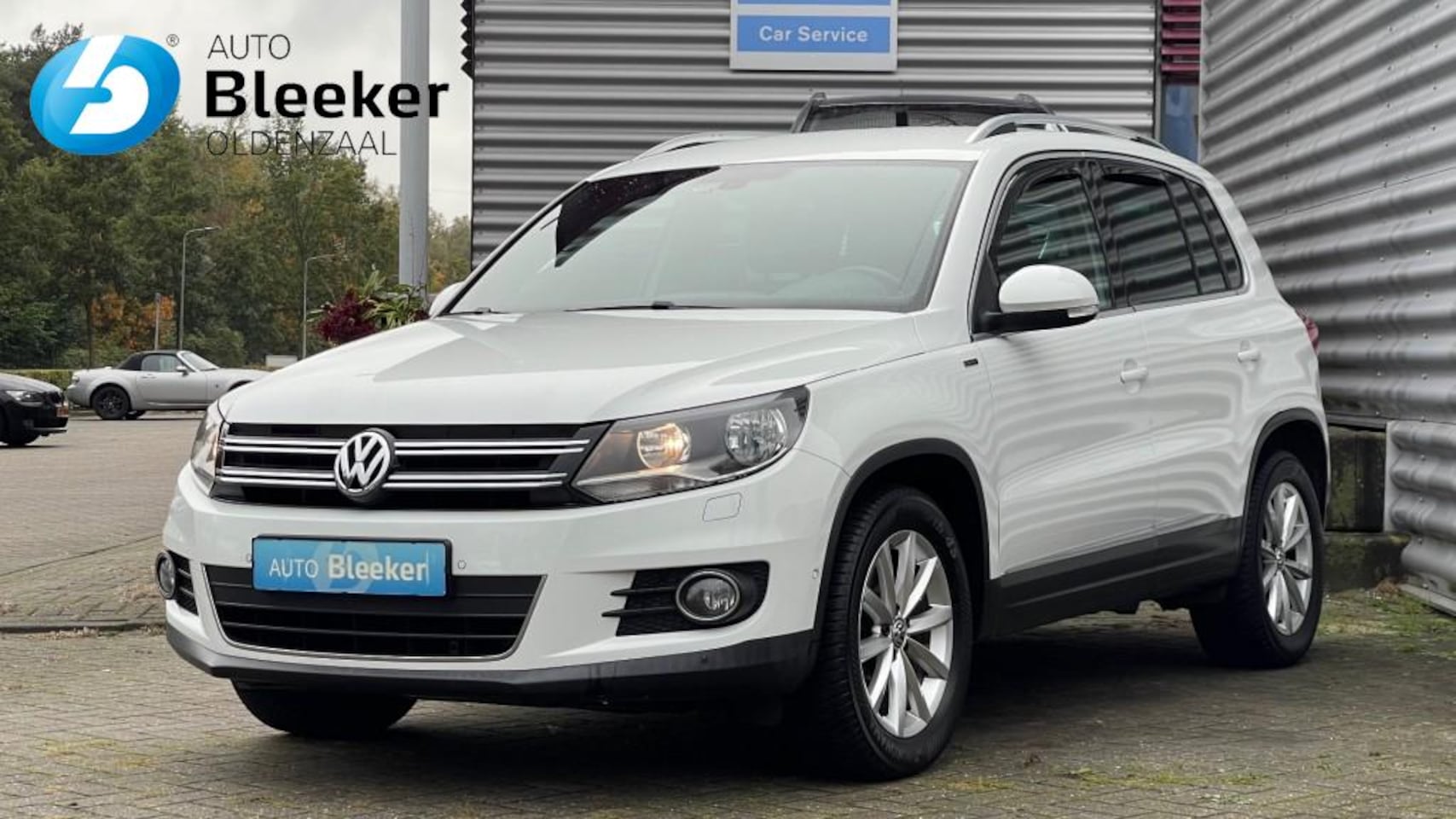 Volkswagen Tiguan - 1.4 TSI  125Pk Lounge Airco Navi Cruise Trekhaak - AutoWereld.nl