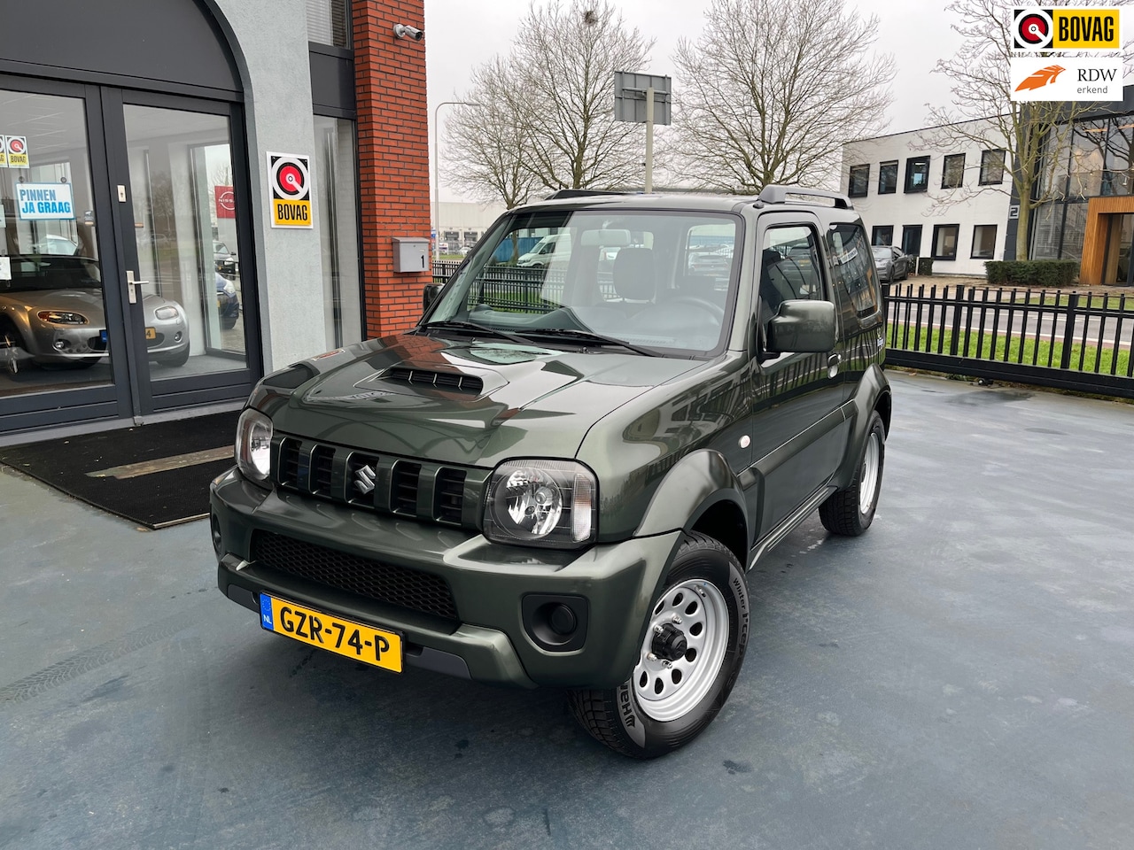 Suzuki Jimny - 1.3 Exclusive 4X4 1STE EIGENAAR TREKHAAK AIRCO - AutoWereld.nl