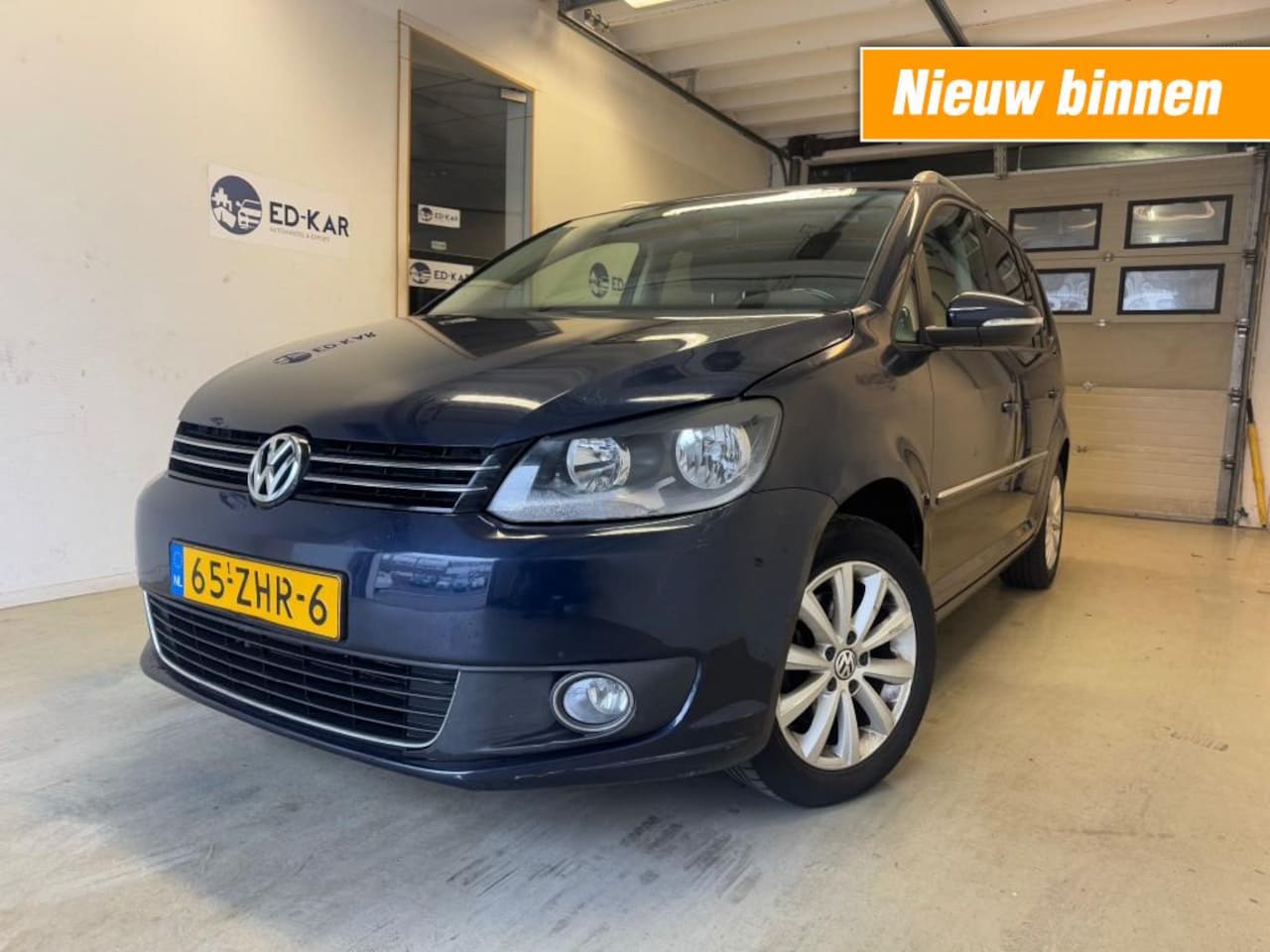 Volkswagen Touran - 1.2 TSI Highline BlueMotion 4PERS NAVI CLIMA PDC NAP APK - AutoWereld.nl