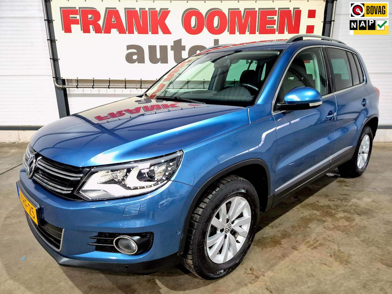 Volkswagen Tiguan - 1.4 TSI 161PK Sport&Style 4Motion + 1e eigenaar|Dealer OH|Bi xenon|Park assist|Navi|Alcant - AutoWereld.nl