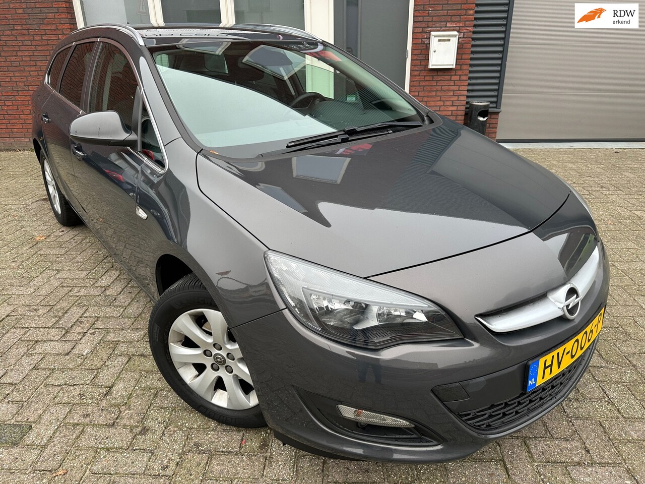 Opel Astra Sports Tourer - 1.4 Turbo Blitz / PDC / NAP / Cruise / Navi / Airco - AutoWereld.nl