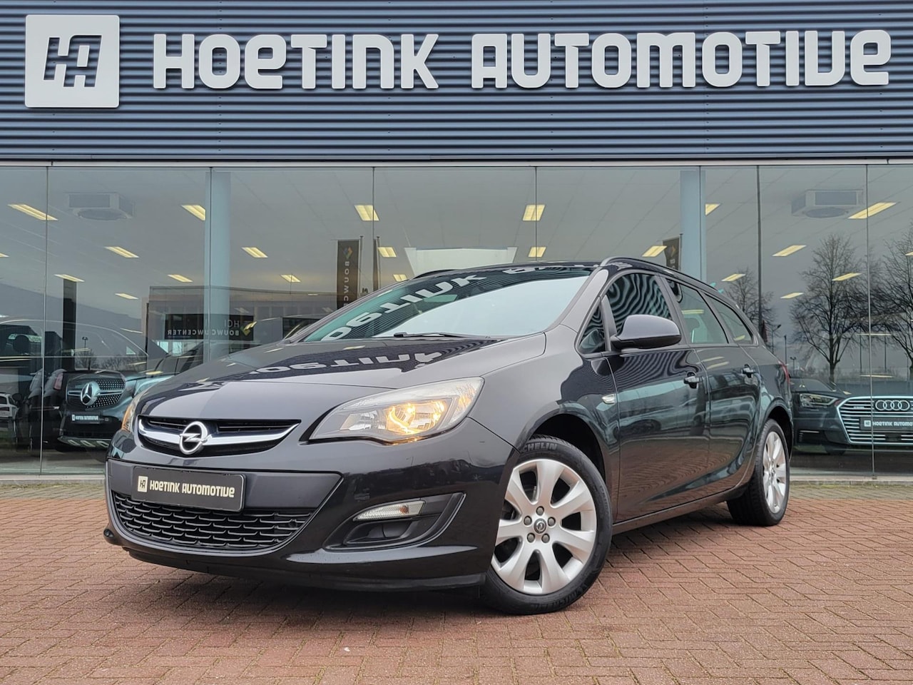 Opel Astra Sports Tourer - 1.4 Business + | Trekhaak | Navi | Cruise - AutoWereld.nl