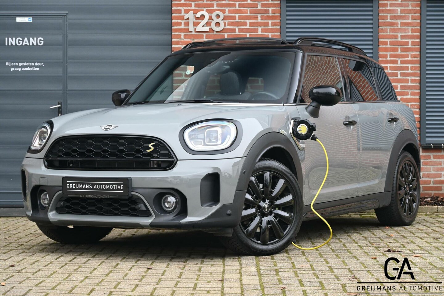 MINI Countryman - 2.0 Cooper S E ALL4|PANO|18''|NAVI|CARPLAY|KEYLESS - AutoWereld.nl