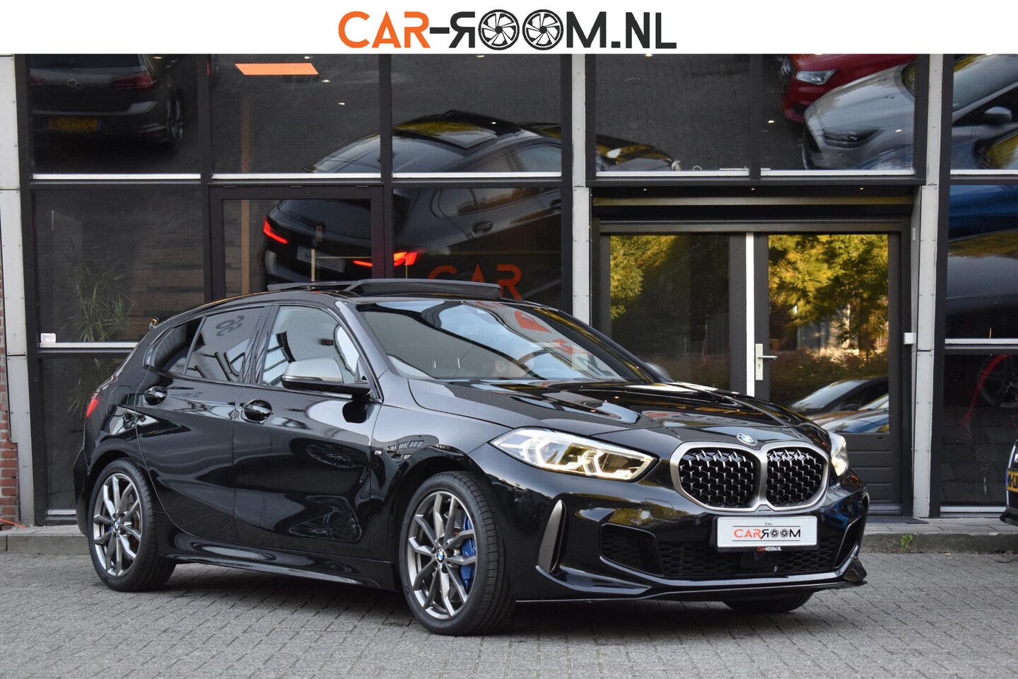 BMW 1-serie - M135i xDrive High Executive Pano Ambiance - AutoWereld.nl