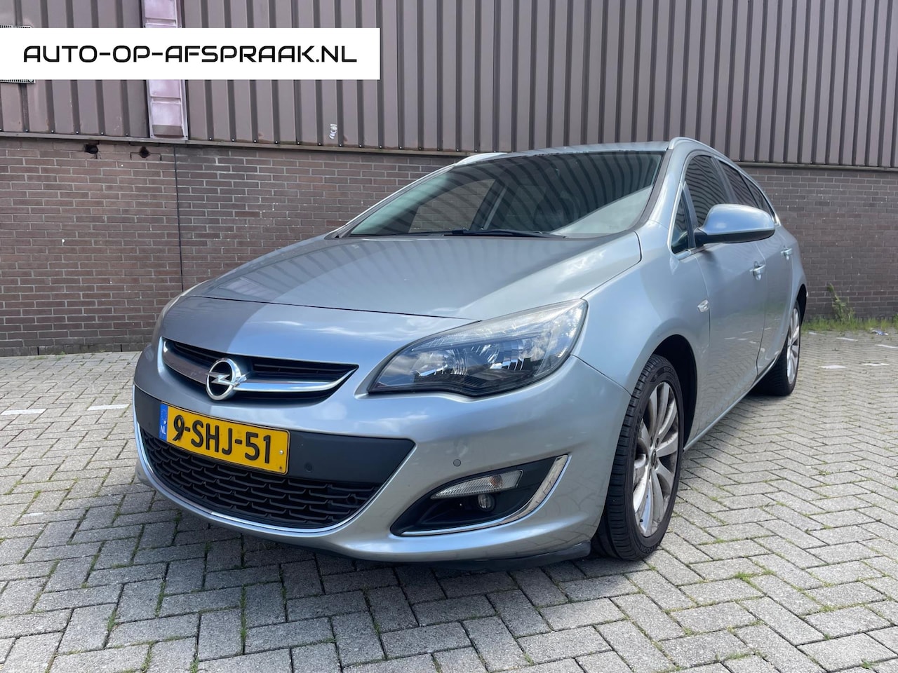 Opel Astra Sports Tourer - 1.4 Turbo Cosmo Pano Navi Airco LPG - AutoWereld.nl