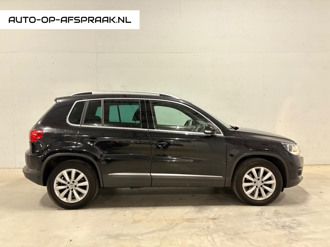 Volkswagen Tiguan - 1.4 TSI Sport&Style Navi Clima PDC Cruise - AutoWereld.nl