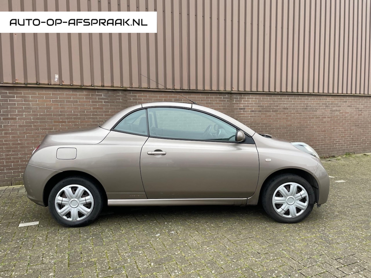 Nissan Micra - 1.4 Tekna Cabrio Clima APK NAP Glasdak - AutoWereld.nl