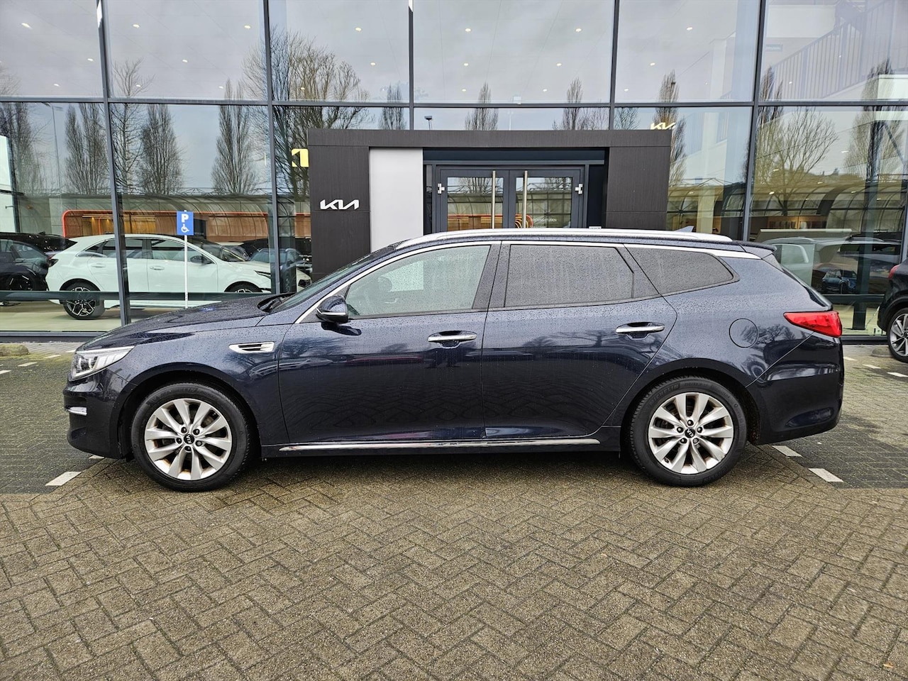 Kia Optima Sportswagon - 1.7 CRDi 141pk DynamicLine Navi/ Leer (Handel/ Export) - AutoWereld.nl