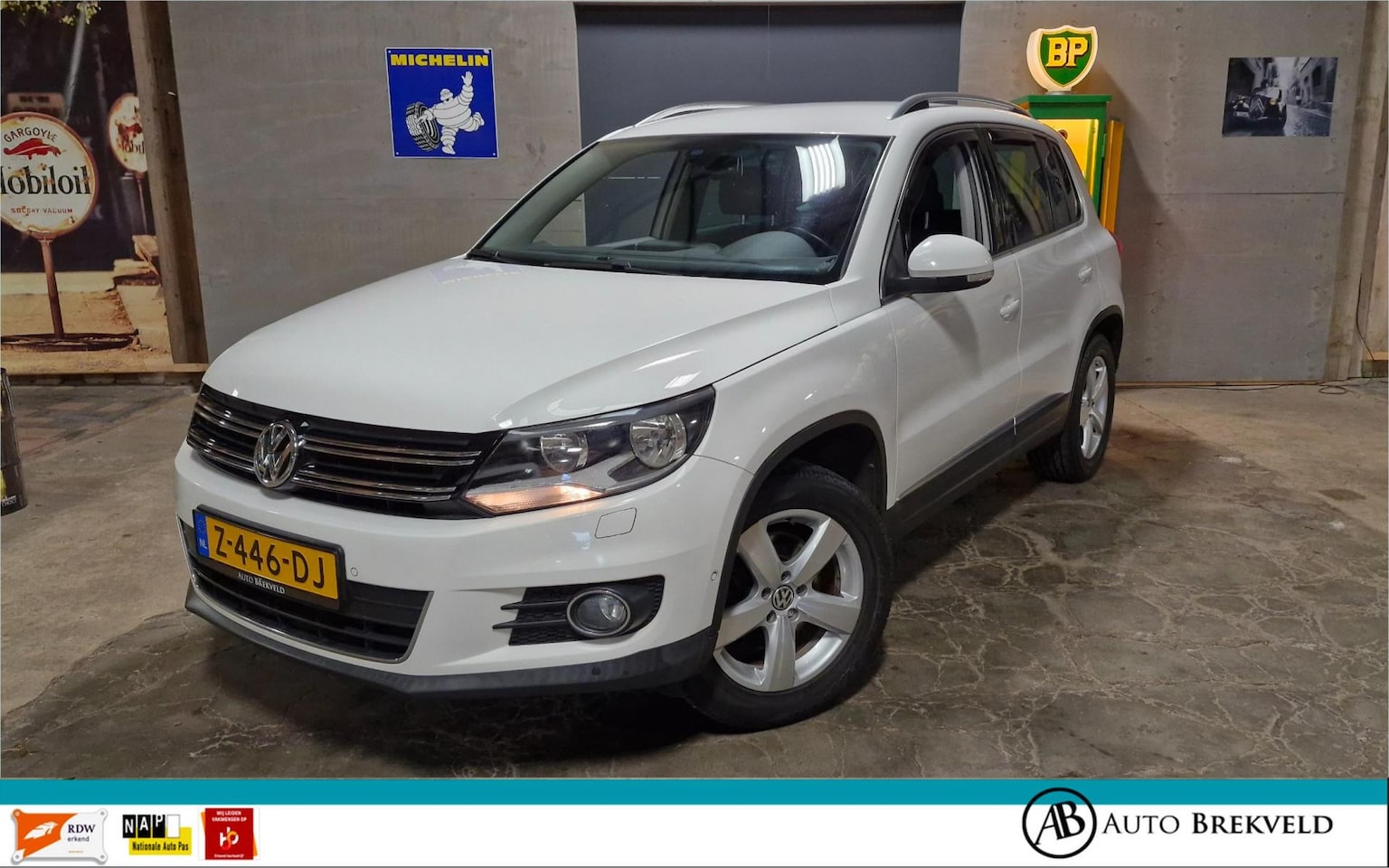 Volkswagen Tiguan - 1.4 TSI Sport&Style 122PK | RIJKLAAR | Cruise | Stoel verw. | Clima | PDC - AutoWereld.nl