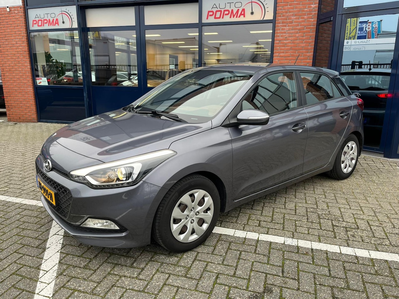 Hyundai i20 - 1.2 HP 85pk i-Motion / Airco / Trekhaak / Cruise control / Reservewiel / - AutoWereld.nl