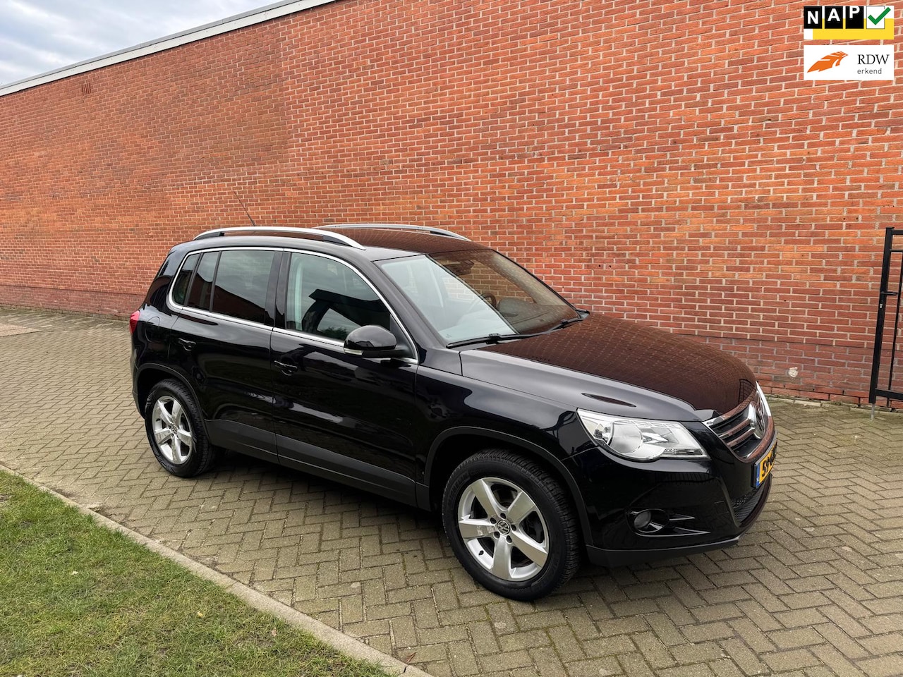 Volkswagen Tiguan - 2.0 TSI Sport&Style 4Motion Clima Cruise DSG - AutoWereld.nl