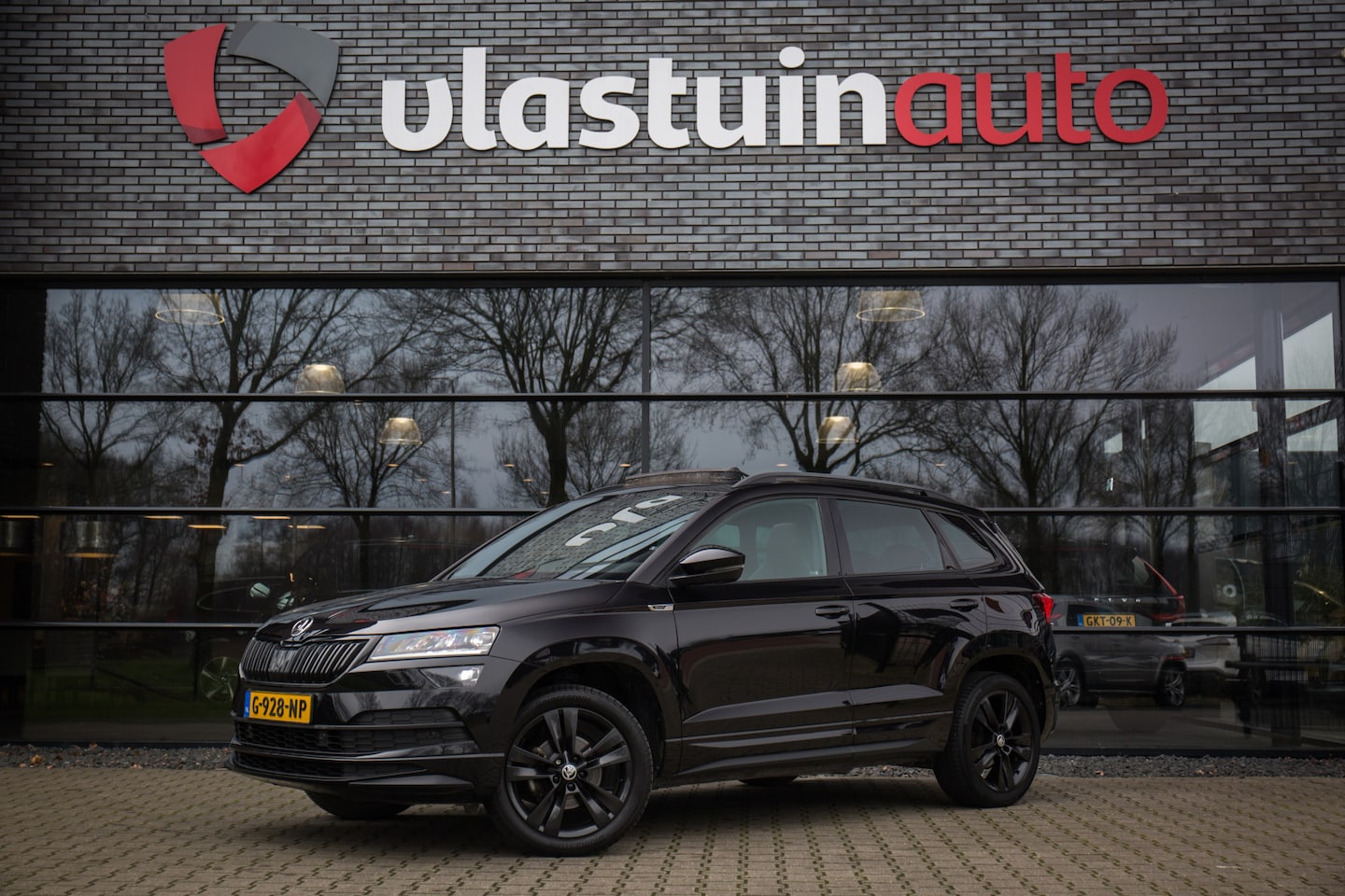 Skoda Karoq - 1.5 TSI ACT Sportline Business 1.5 TSI ACT Sportline Business , Adap. cruise, Pano dak, Trekhaak, Canton audio, - AutoWereld.nl