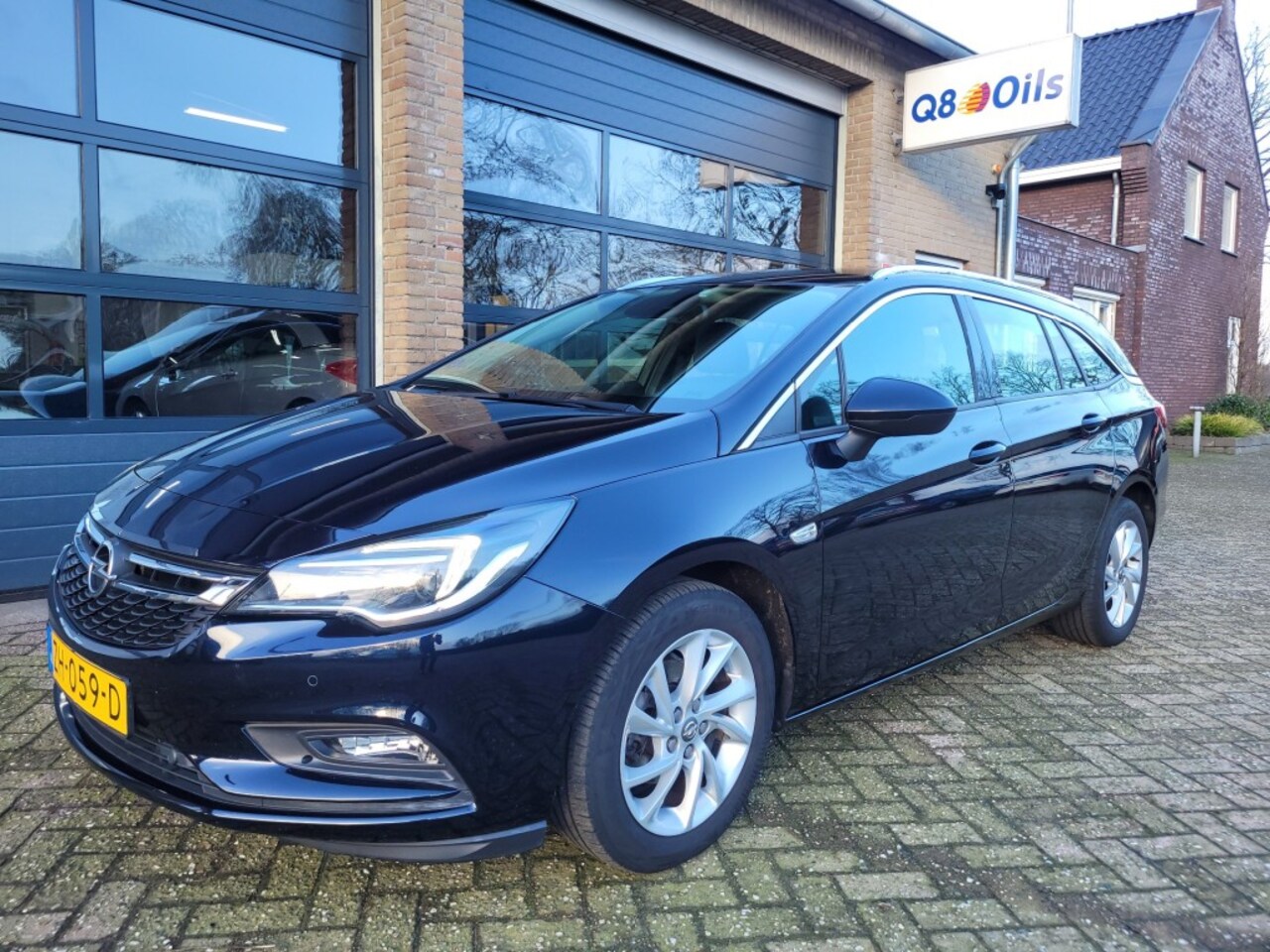 Opel Astra Sports Tourer - SPORTS TOURER 1.4 Turbo 150pk  AUTOMAAT Bus. Exe  Trekhaak - AutoWereld.nl