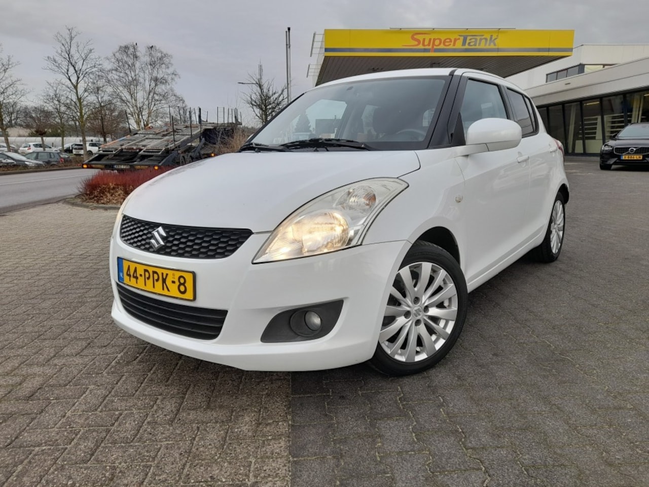 Suzuki Swift - 1.2 EXCLUSIVE EASSS AIRCO TREKHAAK CRUISE - AutoWereld.nl