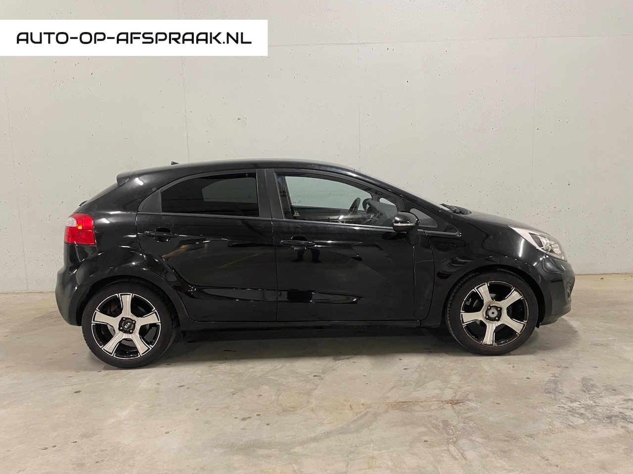 Kia Rio - 1.2 CVVT Design Edition 5drs. Airco Cruise Control - AutoWereld.nl