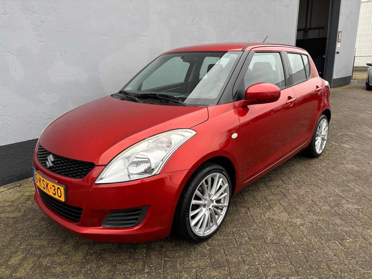 Suzuki Swift - 1.2 Comfort 5-Deurs - Airco - LMV - AutoWereld.nl