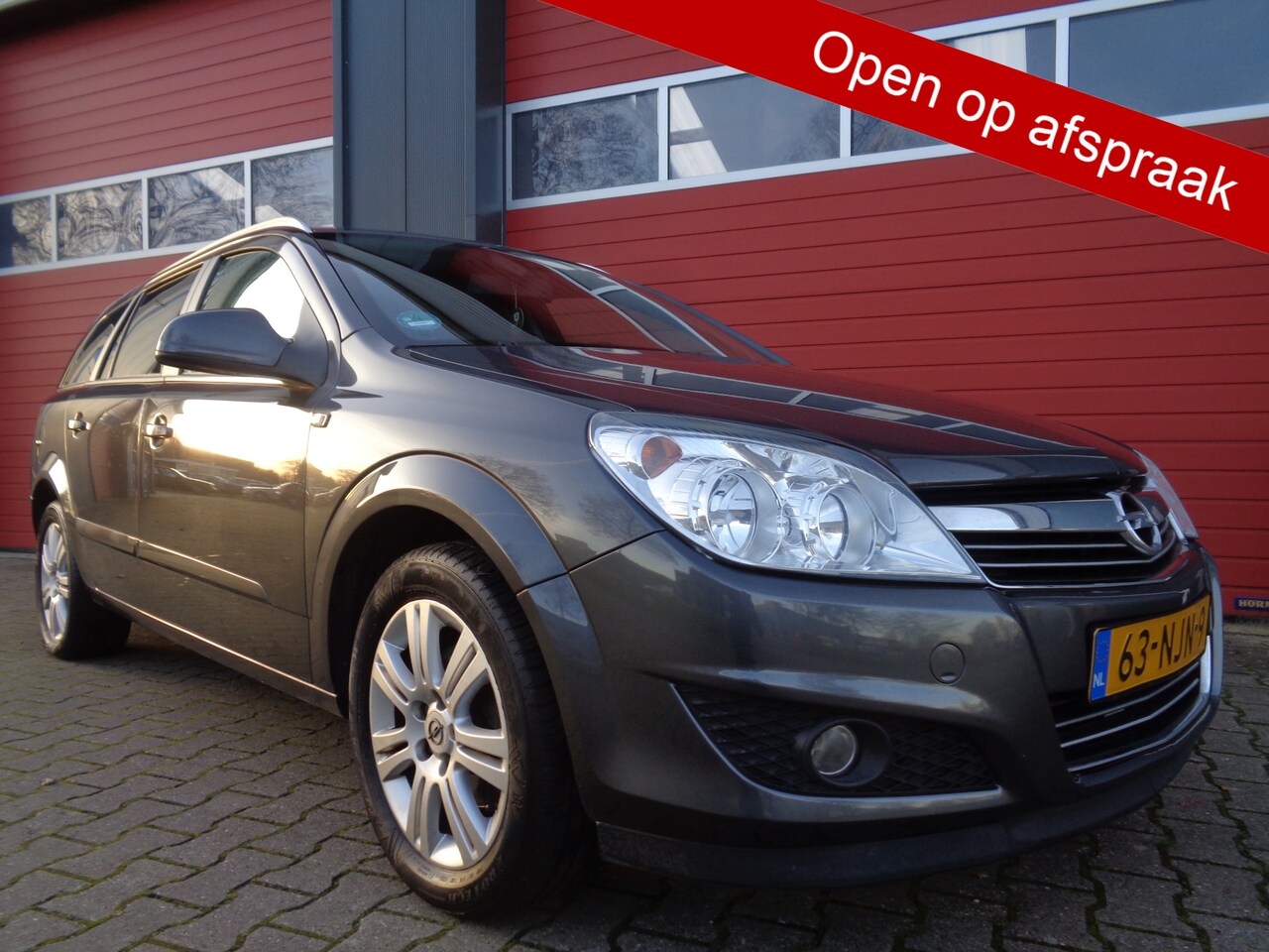 Opel Astra Wagon - 1.6 Cosmo 116PK Clima Cruise LEER LMV Trekhaak NL-Auto - AutoWereld.nl