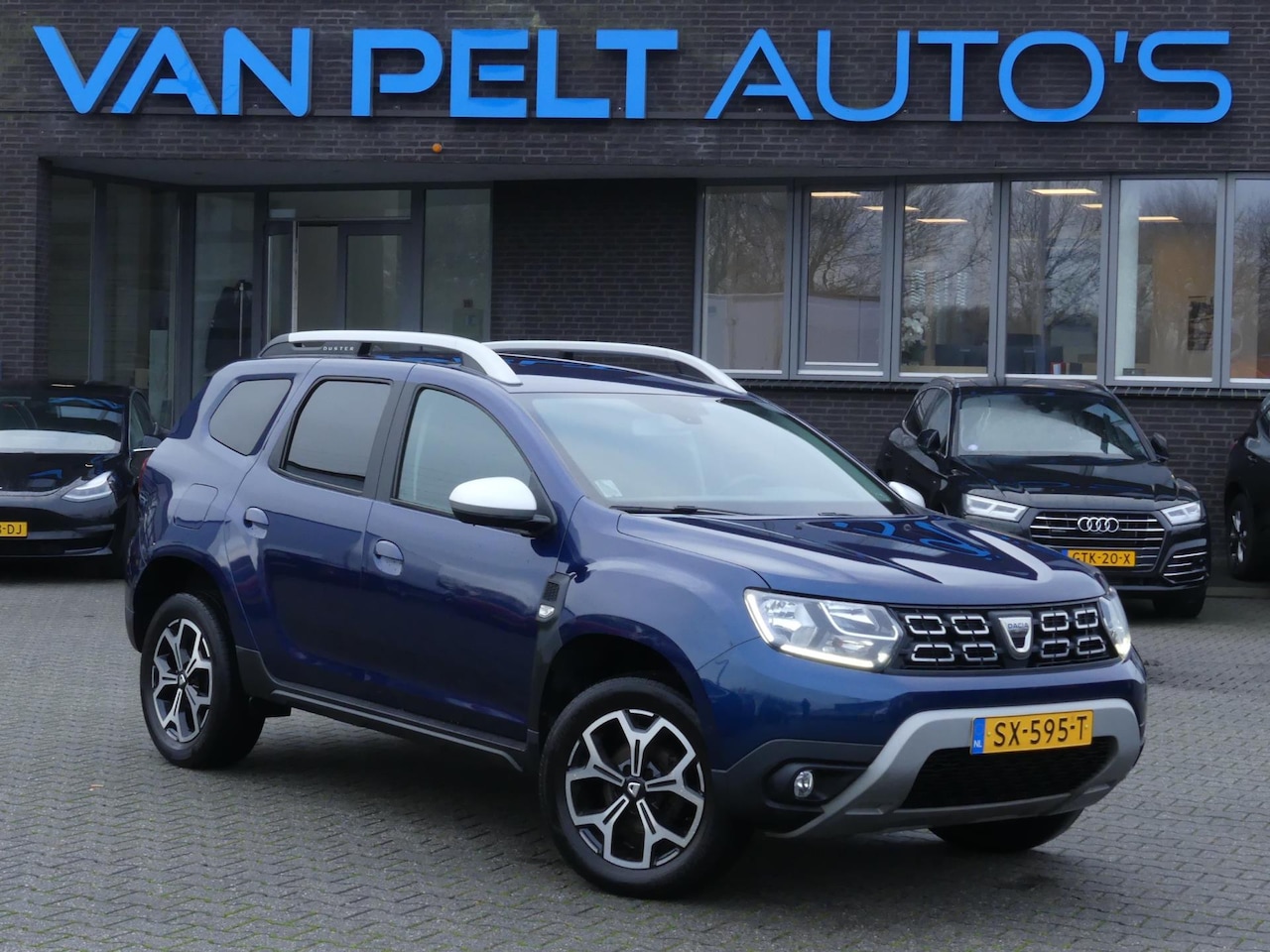 Dacia Duster - 1.2 TCe 125PK Prestige / Camera / Nav / DAB+ - AutoWereld.nl