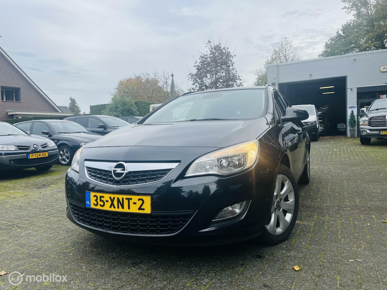 Opel Astra Sports Tourer - 1.4 Turbo Edition Navi / LM / PDC - AutoWereld.nl