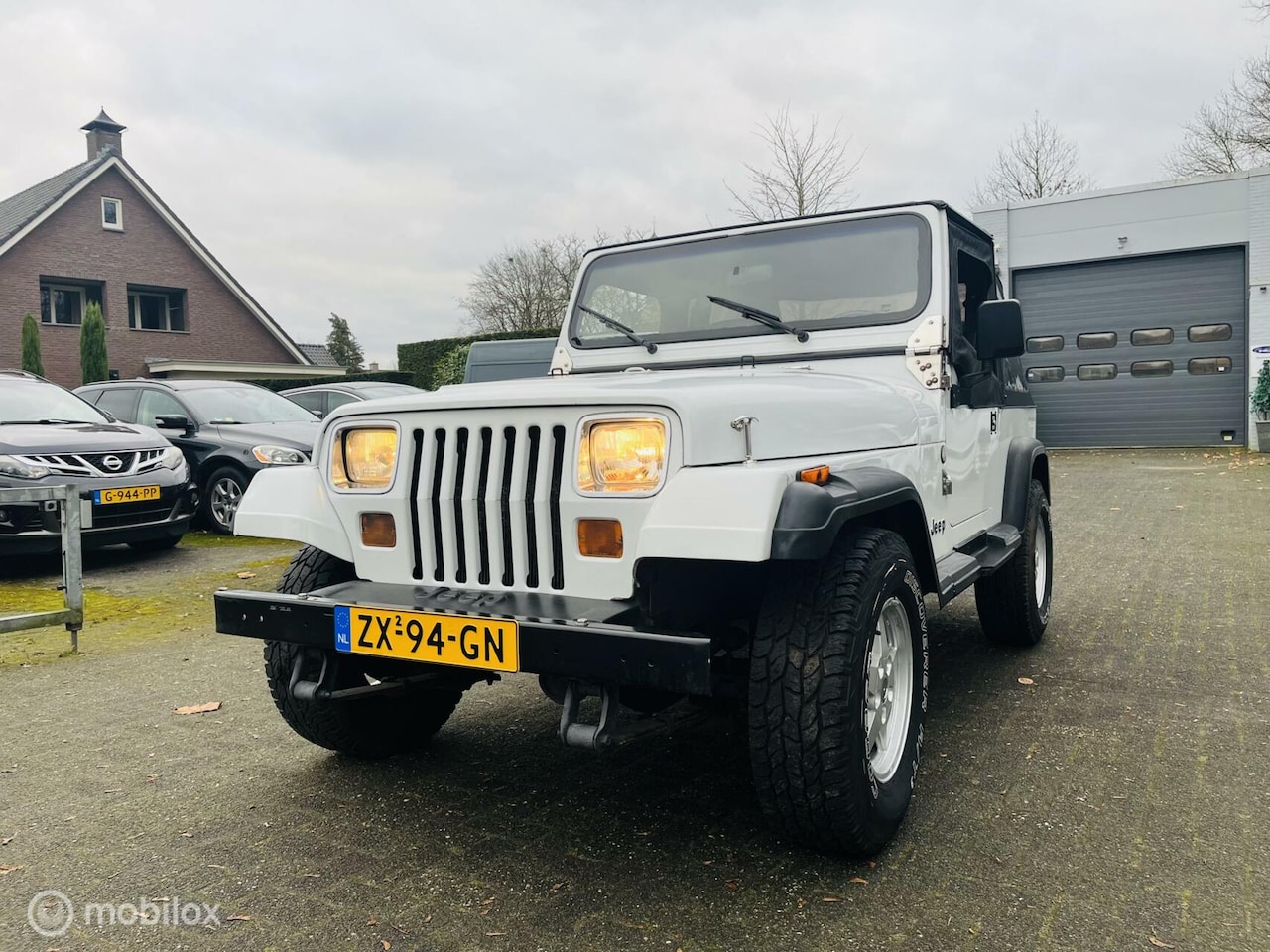 Jeep Wrangler - 4.0i 4x4 Softtop Automaat / NAP / Ned auto / APK 11-2026 - AutoWereld.nl