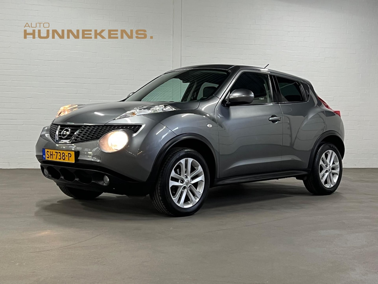 Nissan Juke - 1.6 Tekna | Leder | Keyless | Navigatie | Stoelverwarming | Cruise & Climate c. - AutoWereld.nl