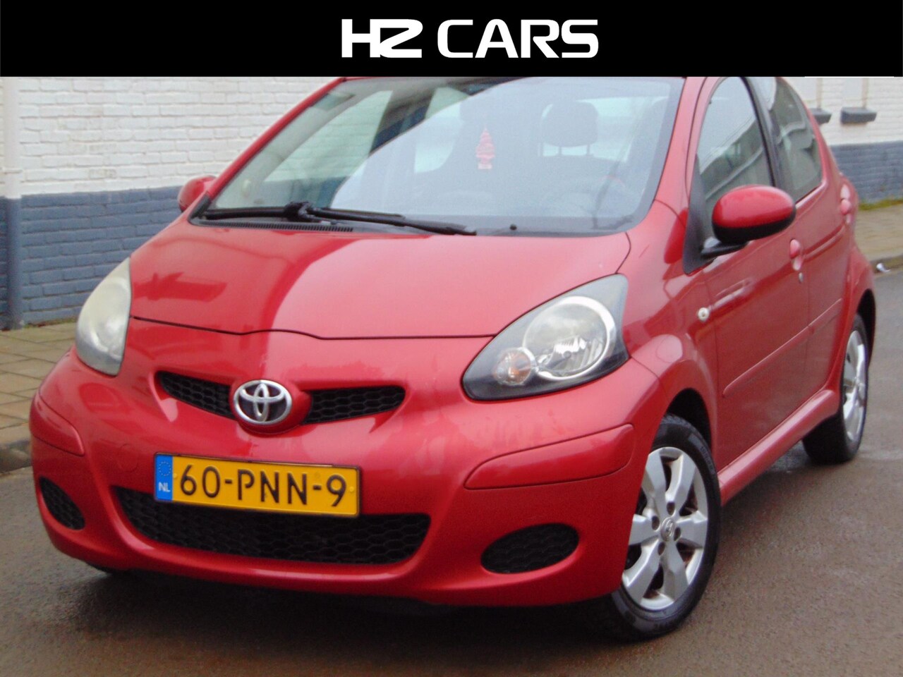 Toyota Aygo - 1.0-12V Aspiration Red Navigator MET NIEUWE APK - AutoWereld.nl