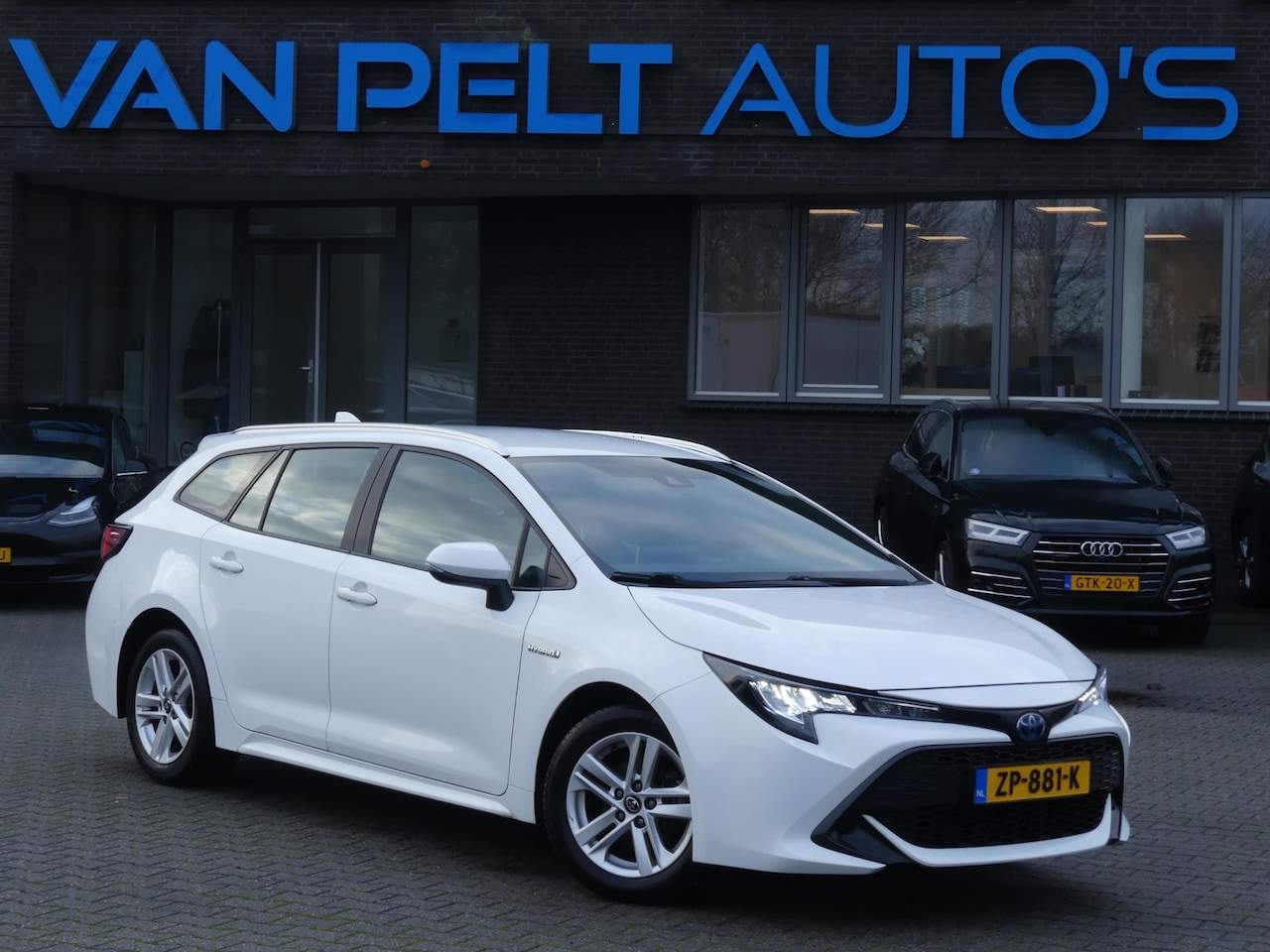 Toyota Corolla Touring Sports - 1.8 Hybrid Active / DAB+ / Camera / Trekhaak - AutoWereld.nl