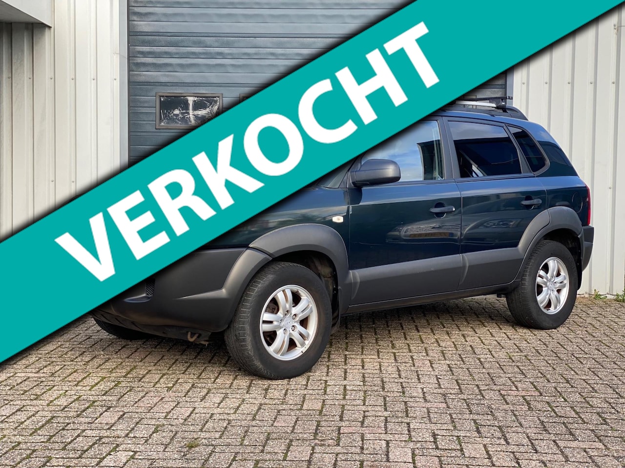 Hyundai Tucson - 2.0i Dynamic Cross 2e EIG / AIRCO / CRUISE! - AutoWereld.nl