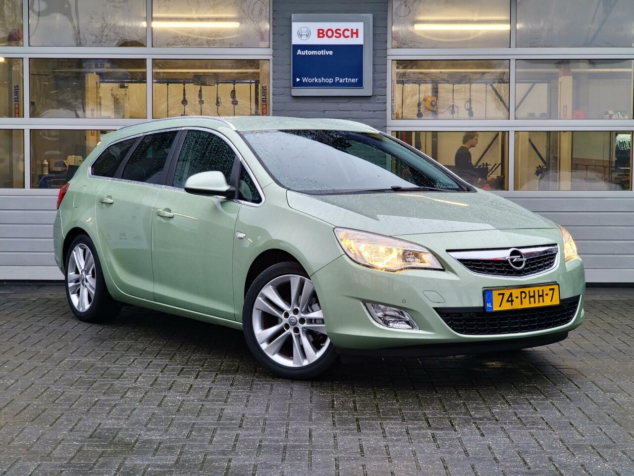 Opel Astra Sports Tourer - 1.4 Turbo Cosmo|leer|sportstoelen|17-inch|Clima|Cruise|Navi|trekhaak| - AutoWereld.nl