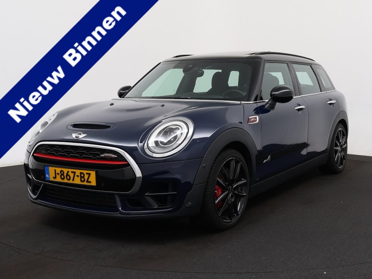 MINI Clubman - Mini 2.0 John Cooper Works ALL4 Chili | Pano | HUD | Winterpakket | Harman Kardon |  04-20 - AutoWereld.nl