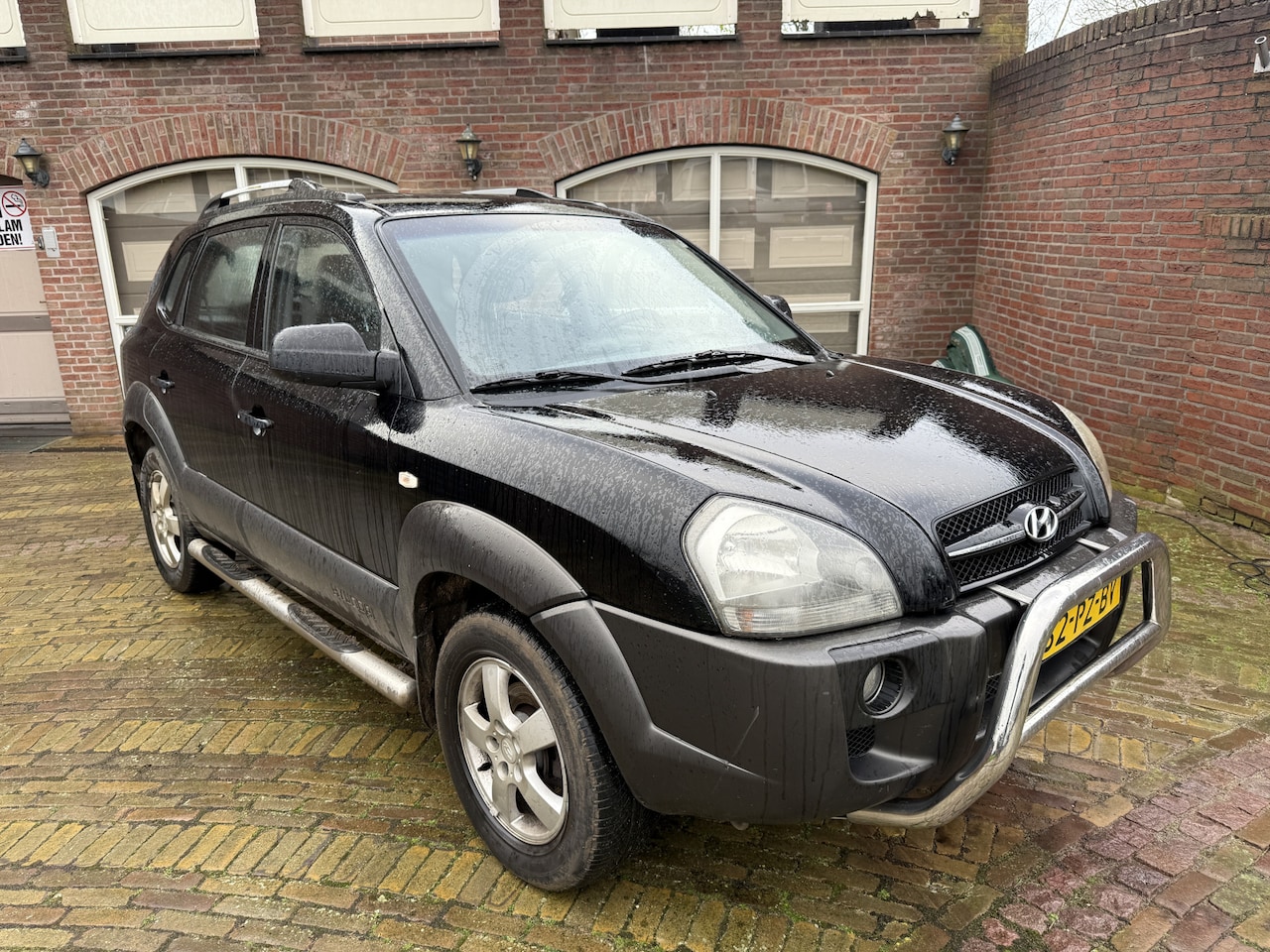 Hyundai Tucson - 2.0i Active Airco/Cruise/Lmvelg/Trekhk - AutoWereld.nl