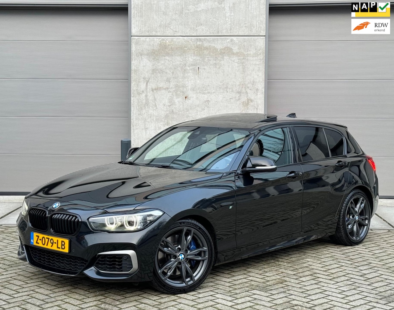 BMW 1-serie - M140i 340pk AUT 2018 Zwart Shadow Line H&K|VOL - AutoWereld.nl