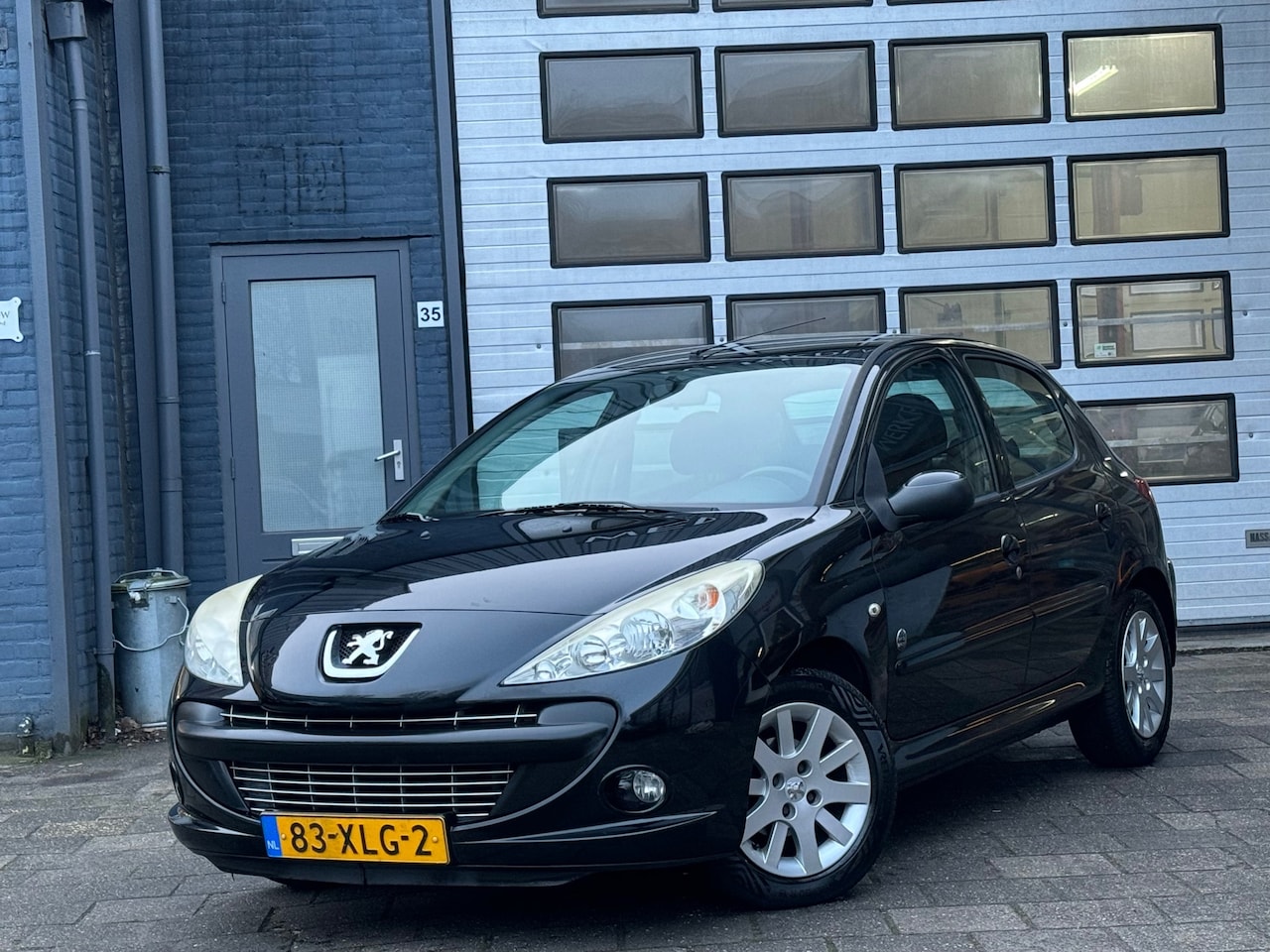 Peugeot 206 - 1.4 Urban Move | Airco | Cruise | LMV | 5-DRS | N.A.P - AutoWereld.nl