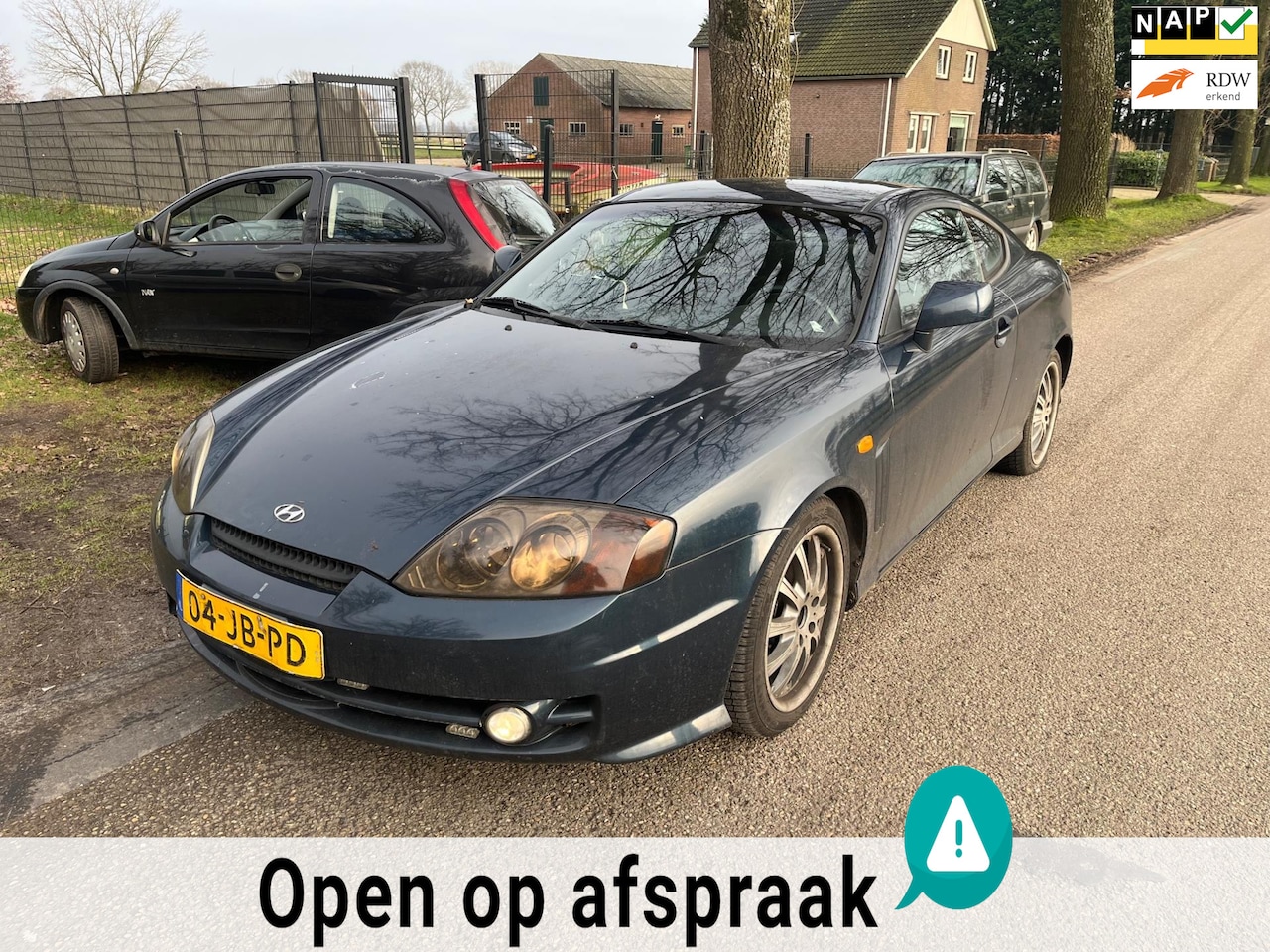 Hyundai Coupé - 2.0i FX COUPE | SCHADE | Airco + Cruise + LMV - AutoWereld.nl