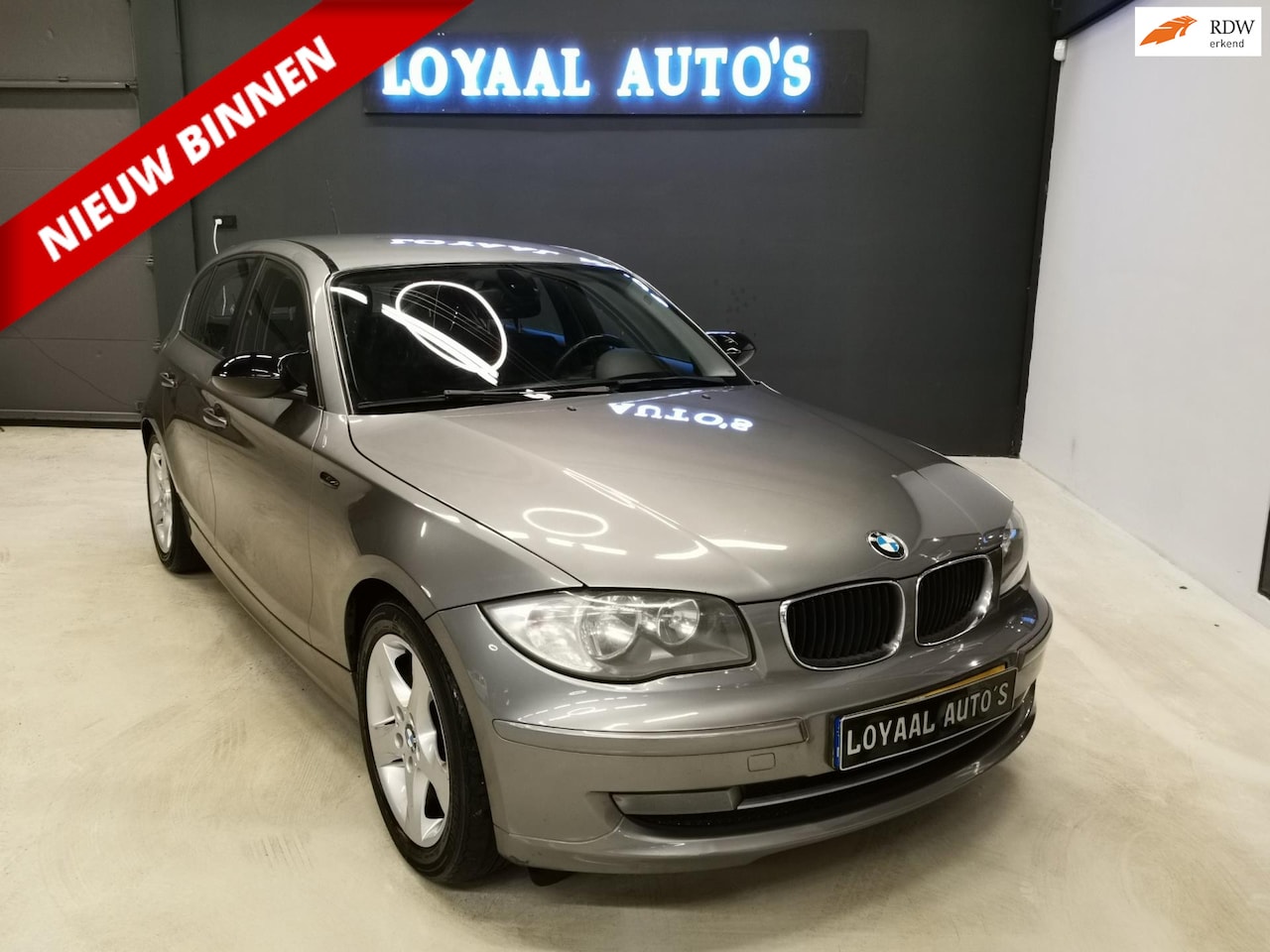 BMW 1-serie - 118i Business Line | AIRCO | CRUISE | ELEK.RAMEN | NAP | APK. - AutoWereld.nl