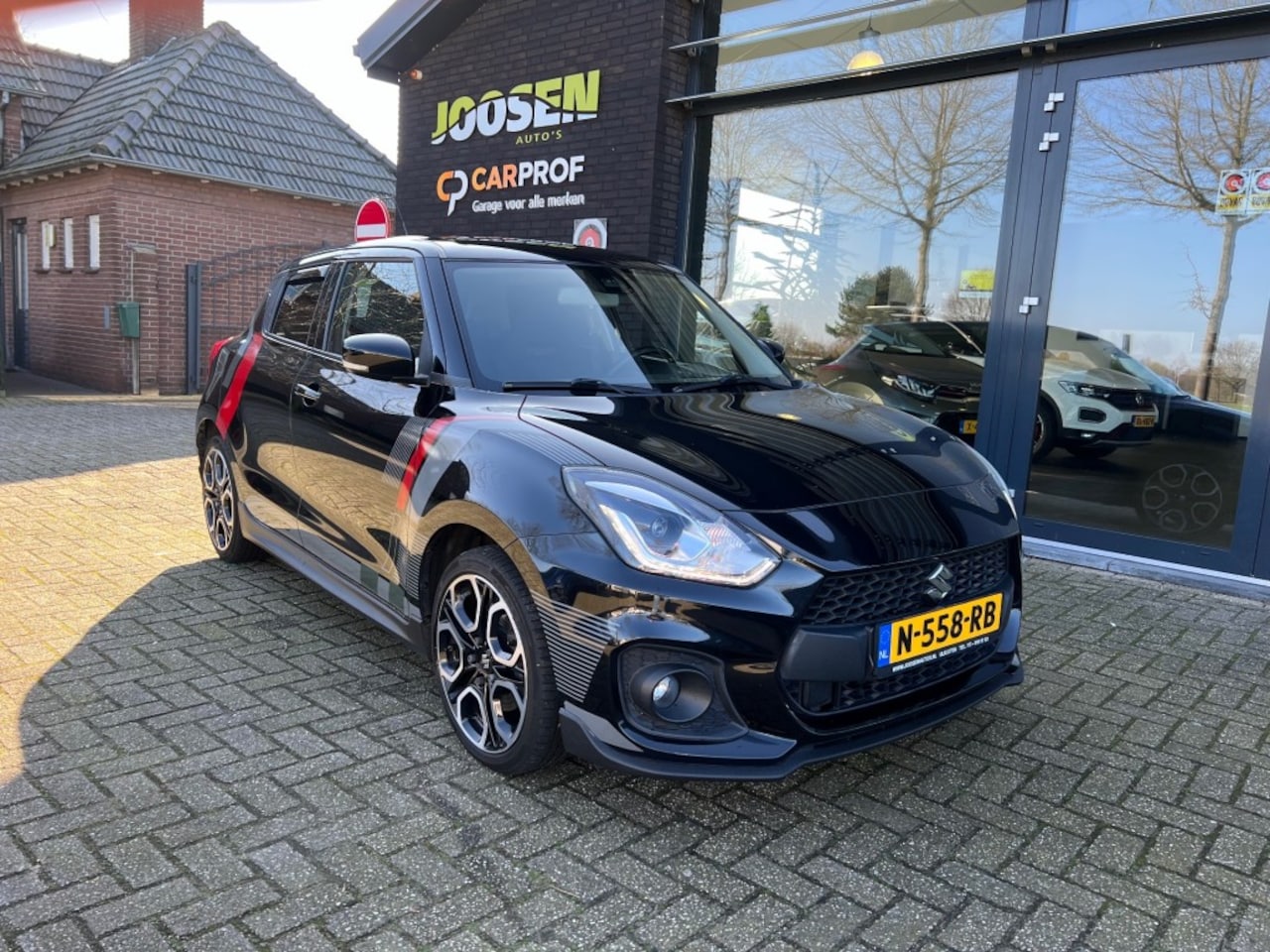 Suzuki Swift - 1.4 SPORT SM.HYB.CARBON UITV - AutoWereld.nl